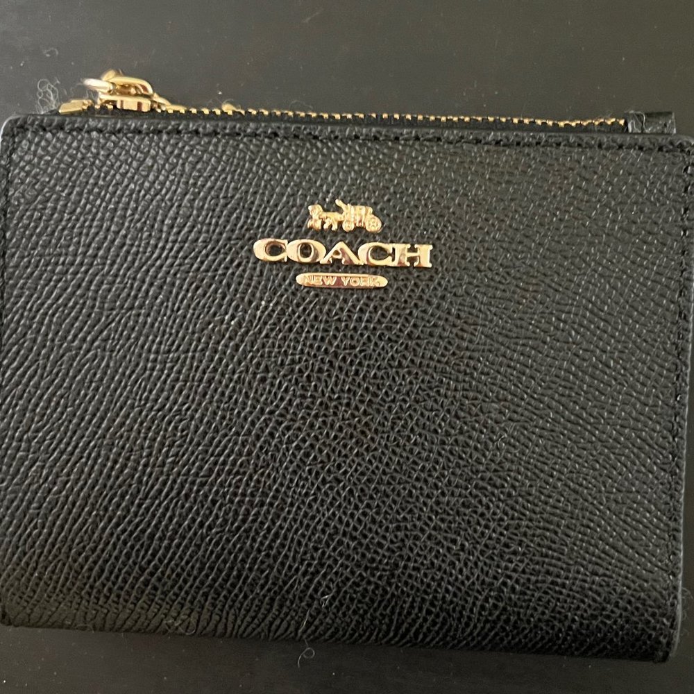 Small black leather Coach wallet